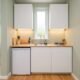 Compact 5x5 kitchenette with single-wall layout showing under-counter fridge, sink, and two-burner hob