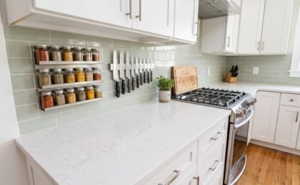 Small kitchen with magnetic spice rack and magnetic knife strip on the wall freeing up counter space
